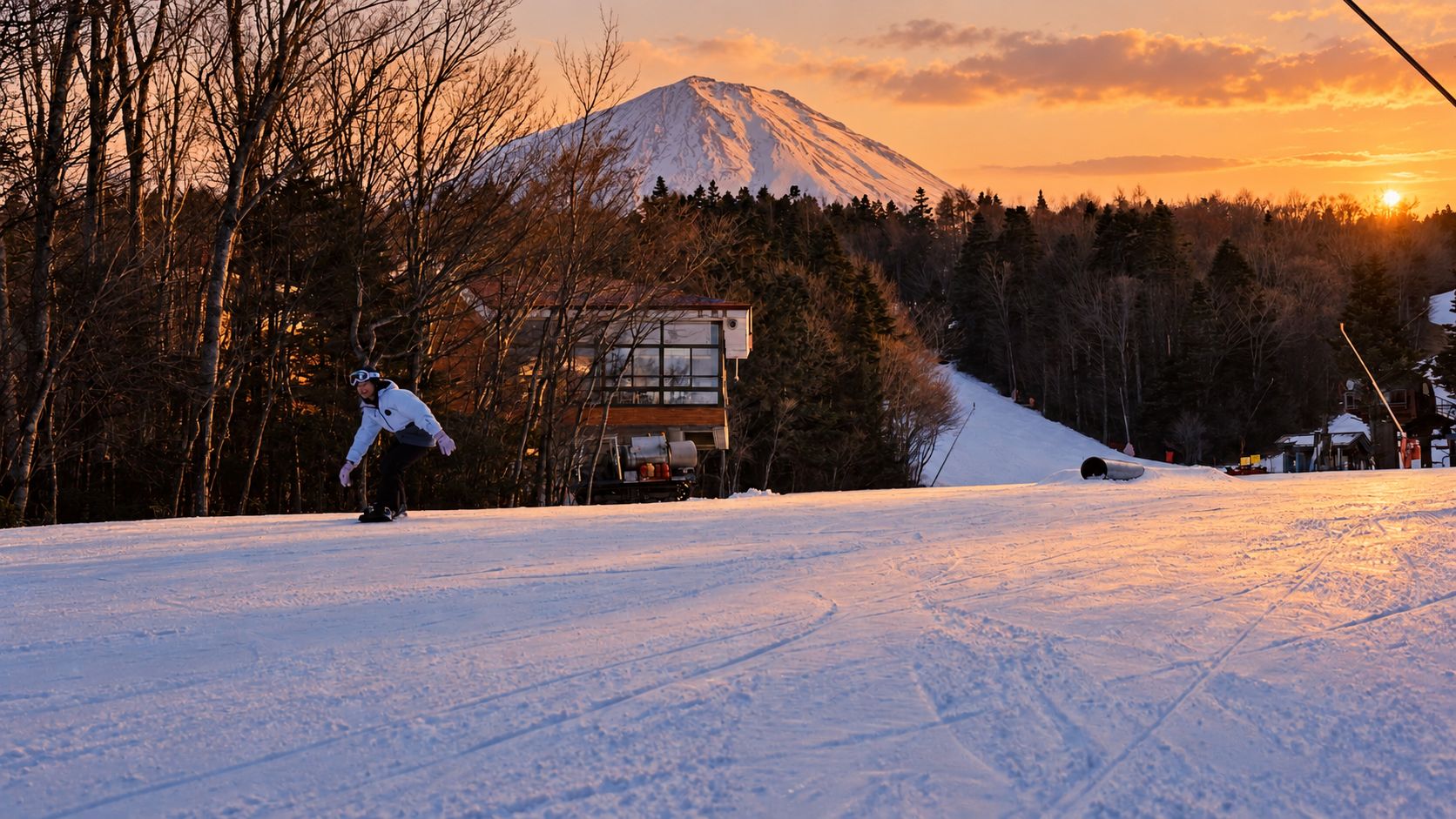 Skiing on a slope in late afternoon light