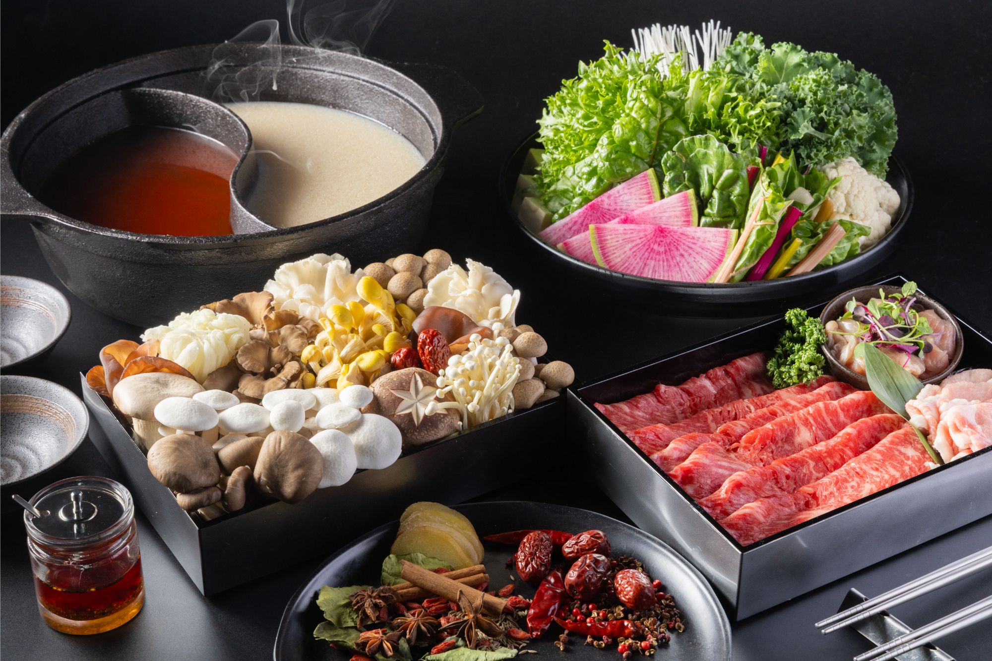 A two-broth hot pot with mushrooms and seasonal vegetables
