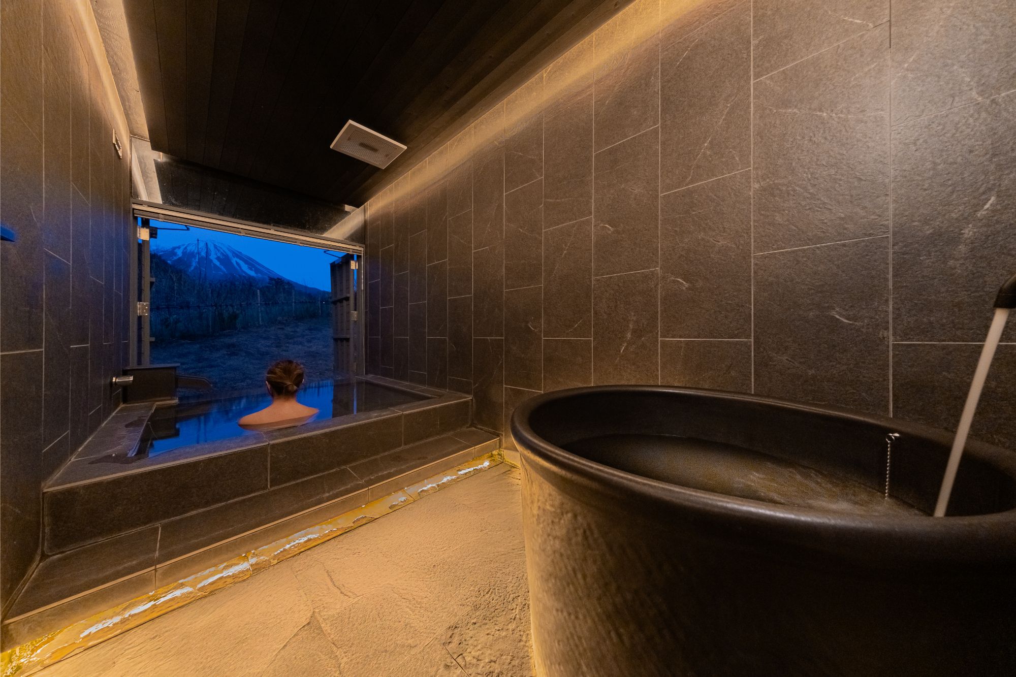 A hot spring bath and cold plunge bath in a guest room